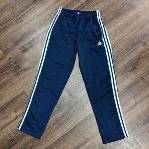 Small blue Adidas track pants